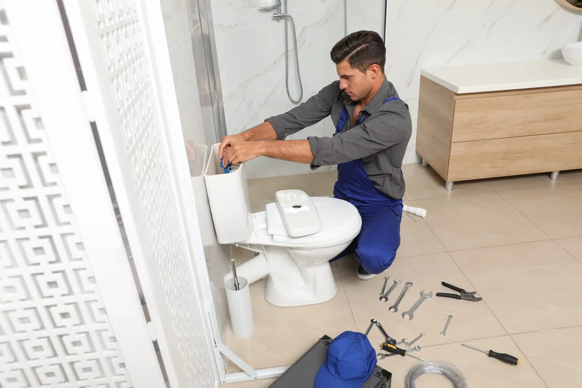plumber-fixing-toilet